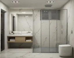 Elegant bathroom by inland interiors in Mangalore with marble finishes, glass partition, and a sleek, functional design.