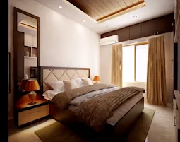 Elegant bedroom interior by the best interior designers Mangalore, featuring warm lighting, modern décor, and a cozy ambiance